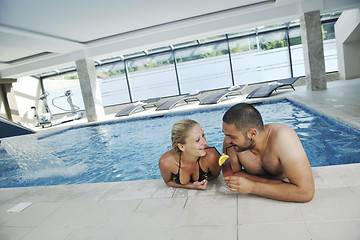 Image showing happy cople at swimming pool