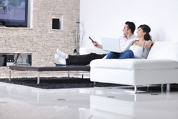 Image showing Relaxed young  couple watching tv at home