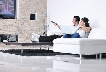 Image showing Relaxed young  couple watching tv at home