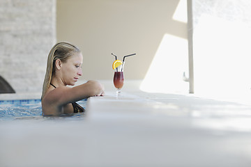 Image showing beautiful woman relax on swimming pool