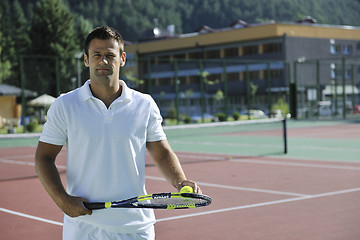 Image showing young man play tennis outdoor