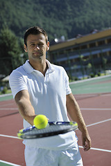 Image showing young man play tennis outdoor