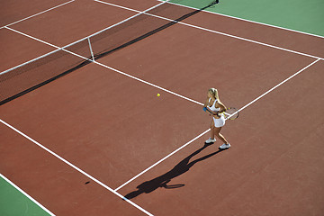 Image showing young woman play tennis outdoor