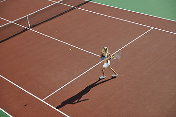 Image showing young woman play tennis outdoor