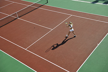 Image showing young woman play tennis outdoor