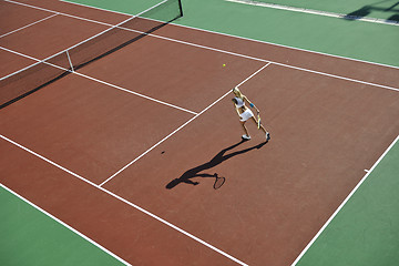 Image showing young woman play tennis outdoor