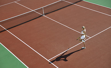 Image showing young woman play tennis outdoor