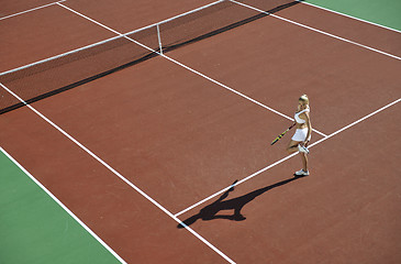 Image showing young woman play tennis outdoor