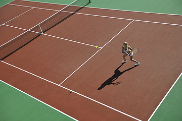 Image showing young woman play tennis outdoor