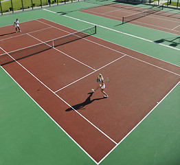 Image showing happy young couple play tennis game outdoor