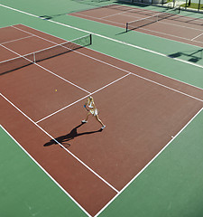 Image showing young woman play tennis outdoor