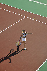 Image showing young woman play tennis outdoor