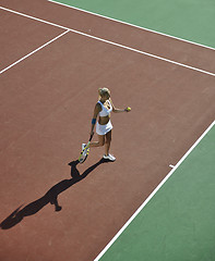 Image showing young woman play tennis outdoor