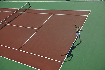 Image showing young woman play tennis outdoor