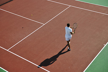 Image showing young man play tennis outdoor