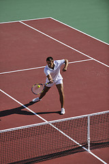 Image showing young man play tennis outdoor