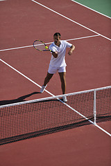 Image showing young man play tennis outdoor