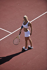 Image showing young woman play tennis outdoor