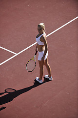 Image showing young woman play tennis outdoor