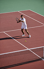 Image showing young woman play tennis outdoor