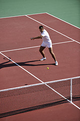 Image showing young man play tennis