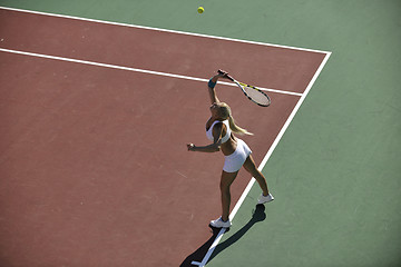 Image showing young woman play tennis outdoor