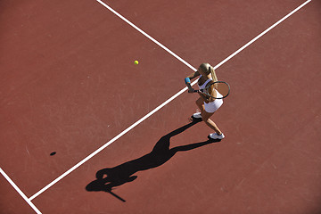 Image showing young woman play tennis outdoor