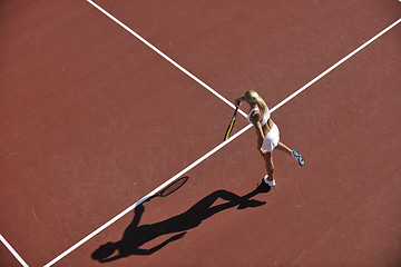 Image showing young woman play tennis outdoor