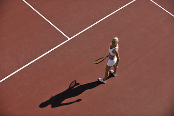 Image showing young woman play tennis outdoor