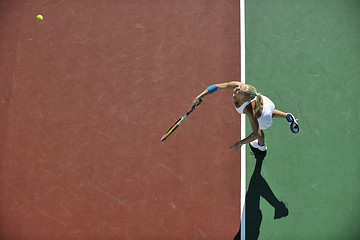 Image showing young woman play tennis outdoor