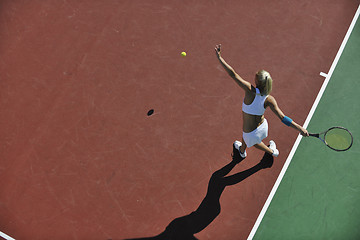 Image showing young woman play tennis outdoor