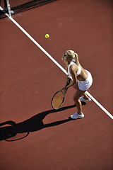 Image showing young woman play tennis outdoor