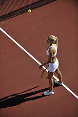 Image showing young woman play tennis outdoor