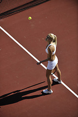 Image showing young woman play tennis outdoor