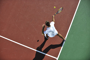 Image showing young man play tennis outdoor