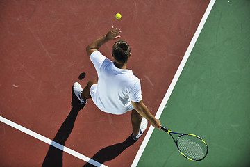 Image showing young man play tennis outdoor