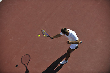 Image showing young man play tennis outdoor