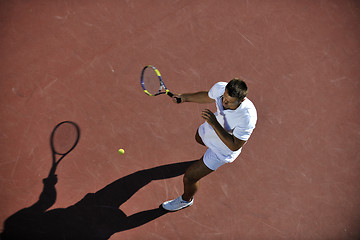 Image showing young man play tennis