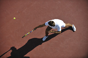 Image showing young man play tennis outdoor