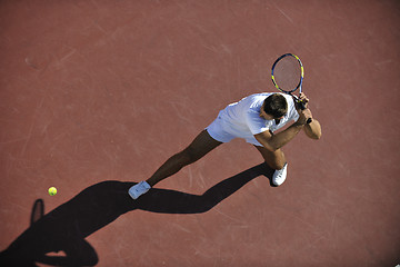 Image showing young man play tennis outdoor