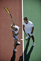 Image showing happy young couple play tennis game outdoor