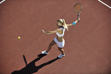 Image showing young woman play tennis outdoor