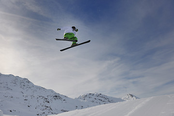 Image showing happy young man have fun at winter on mountain peak