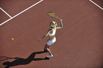 Image showing young woman play tennis outdoor