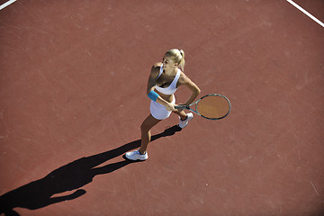 Image showing young woman play tennis outdoor