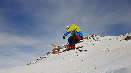 Image showing happy young man have fun at winter on mountain peak