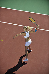 Image showing young woman play tennis outdoor