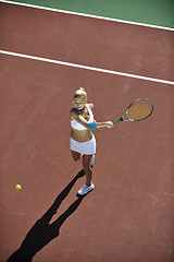 Image showing young woman play tennis outdoor