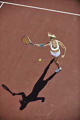 Image showing young woman play tennis outdoor