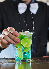 Image showing pro barman prepare coctail drink on party